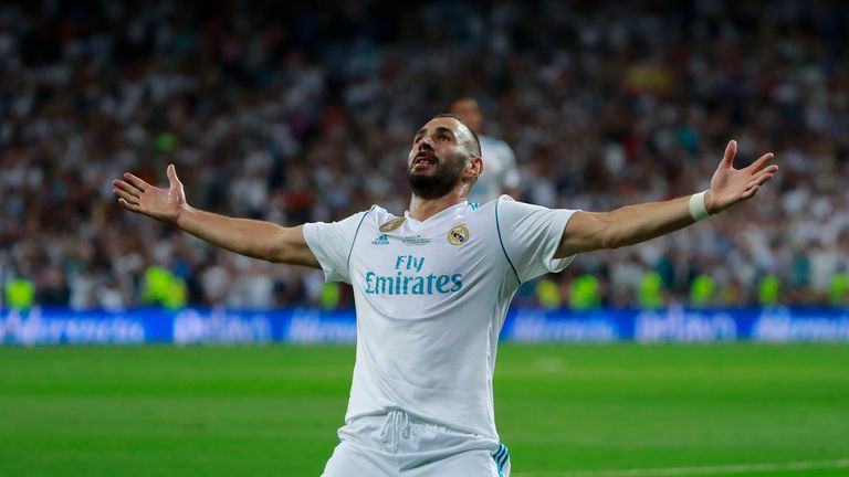 Karim Benzema milks the supporters' applause after scoring Real Madrid's second goal