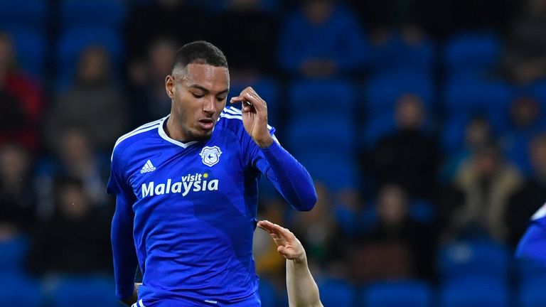 CARDIFF, WALES - DECEMBER 13:  Cardiff player Kenneth Zohore (l) challenges Jon Dadi Bodvarsson of Wolves during the Sky Bet Championship match between Car