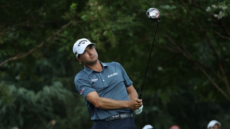 Kevin Kisner plays his shot from the 11th tee during his third round