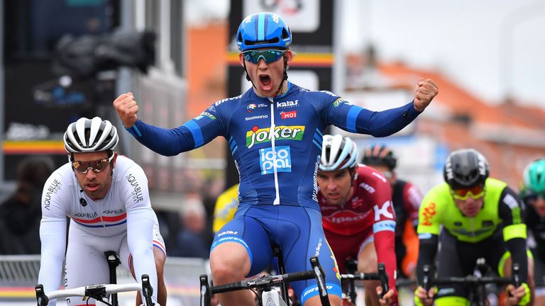 Norway's Kristoffer Halvorsen celebrates as he crosses the finish line to win the seventh edition of the one-day 'Handzame Classic' cycling race over 192,7