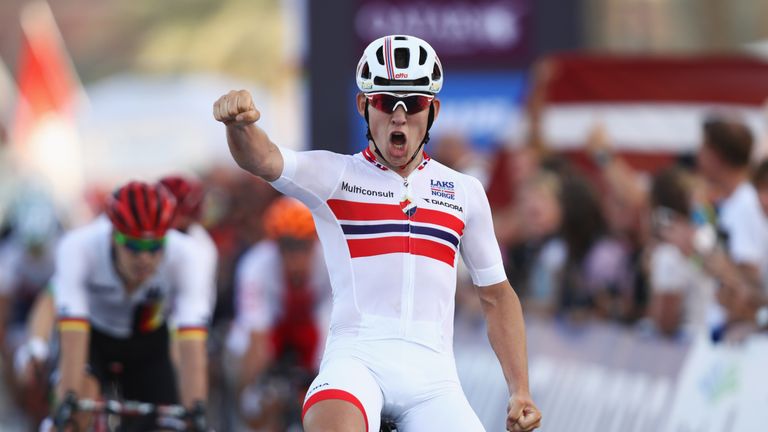 DOHA, QATAR - OCTOBER 13:  Kristoffer Halvorsen of Norway celebrates victory as he crosses the line to win the Men's Under 23 Road Race on Day Five of the 