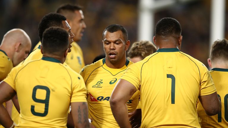 Kurtley Beale (centre) and Australia shipped eight tries on Saturday