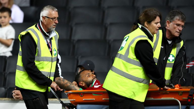 Swansea defender Kyle Bartley was taken off injured on a stretcher 