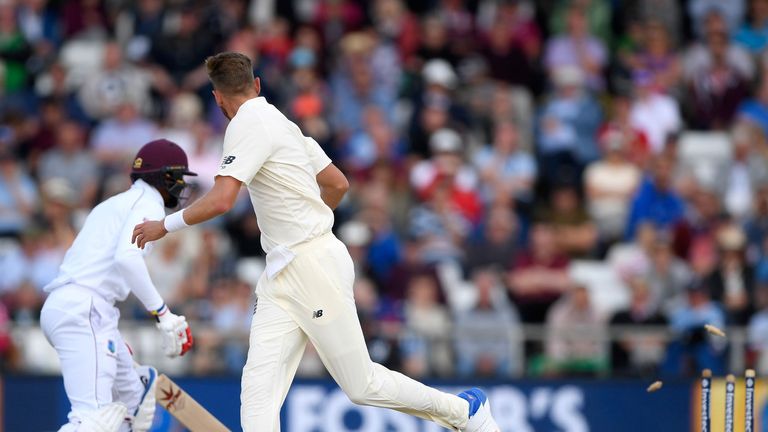 Stuart Broad looks back after dropping Kraigg Brathwaite to see Kyle Hope run out