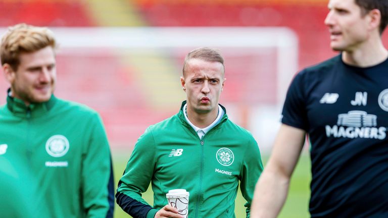 Celtic's Leigh Griffiths inspects the pitch at Firhill