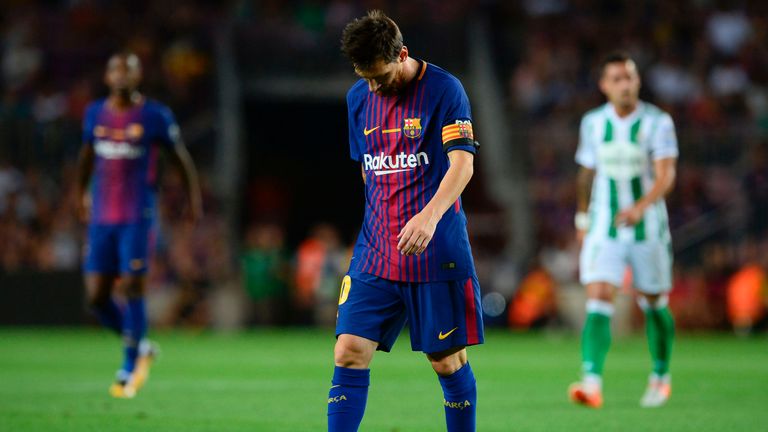 Barcelona's Argentinian forward Lionel Messi walks on the pitch during the Spanish league footbal match FC Barcelona vs Real Betis at the Camp Nou stadium 