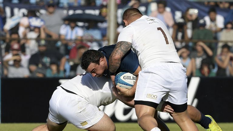 Argentina's Los Pumas hooker Agustin Creevy (C) is tackled by Georgia's prop Soso Bekoshvili (L) and prop Mikheil Nariashvili during their Rugby Union test