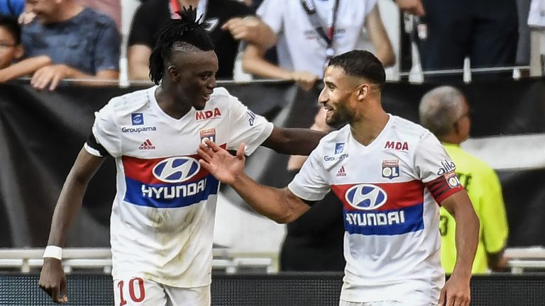 Lyon's Burkinabe forward Bertrand Traore (L) celebrates with Lyon's French forward Nabil Fekir after scoring a goal during the L1 football match Olympique 