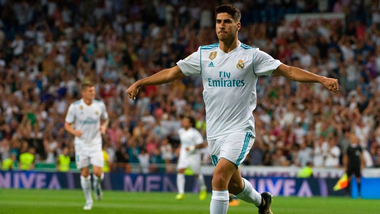 Real Madrid's midfielder Marco Asensio celebrates after scoring during the Spanish league football match Real Madrid CF vs Valencia CF at the Santiago Bern
