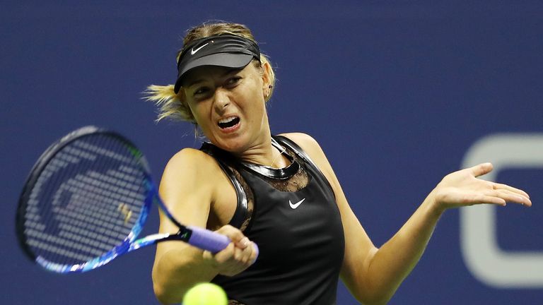 Maria Sharapova plays a shot during her first round Women's Singles match against Simona Halep