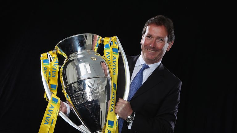 TWICKENHAM, ENGLAND - AUGUST 24:  Mark McCafferty, Chief Executive of Premiership Rugby poses for a photograph witht the Aviva Premiership Trophy during th