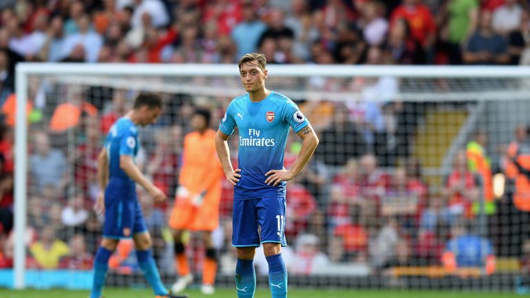 LIVERPOOL, ENGLAND - AUGUST 27:  Mesut Ozil of Arsenal is dejected after Liverpool's fourth goal during the Premier League match between Liverpool and Arse