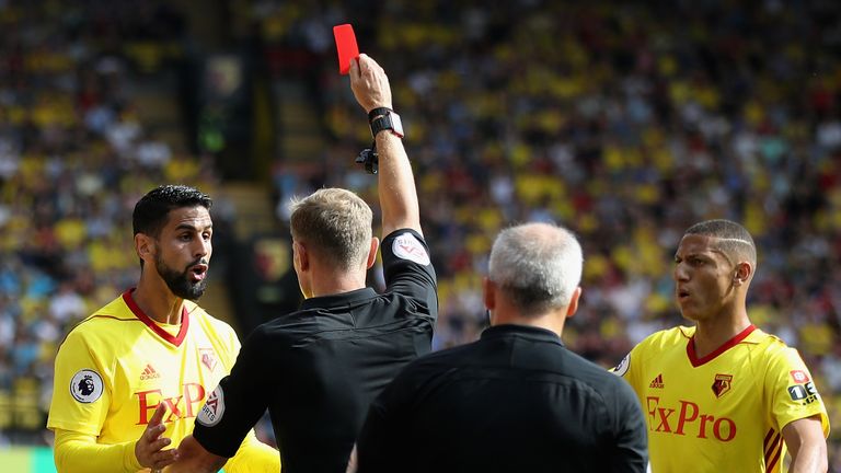 WATFORD, ENGLAND - AUGUST 26:  Referee Graham Scott shows a red card to Miguel Britos of Watford during the Premier League match between Watford and Bright