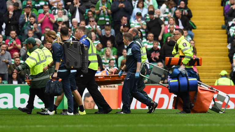 Murray Davidson is stretchered off at Celtic Park