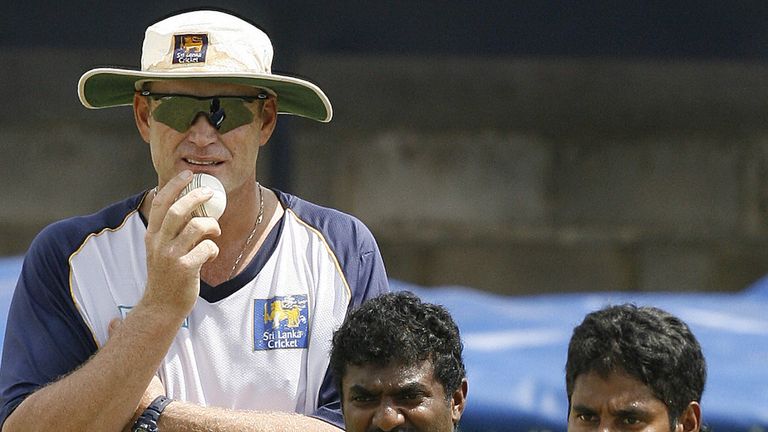 Sri Lanka Cricket Coach Tom Moody (L), Chaminda Vaas (R) and Muttiah Muralitharan (C) watch others during the training session