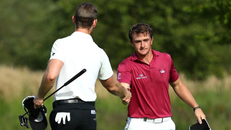 PASSAU, GERMANY - AUGUST 17:  Paul Dunne of Ireland (R) is congratulated by Nathan Holman of Australia on the 13th green after winning his match during rou