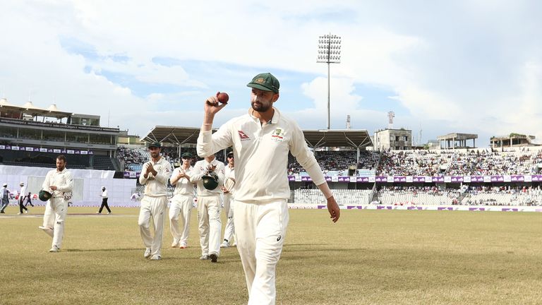 MIRPUR, BANGLADESH - AUGUST 29: Nathan Lyon of Australia holds up the ball after taking five wickets in the innings during day three of the First Test matc