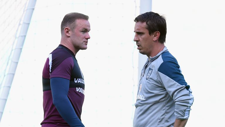 England captain Wayne Rooney (l) chats with coach Gary Neville during England Training ahead of  sunday's UEFA EURO 2016 Qu