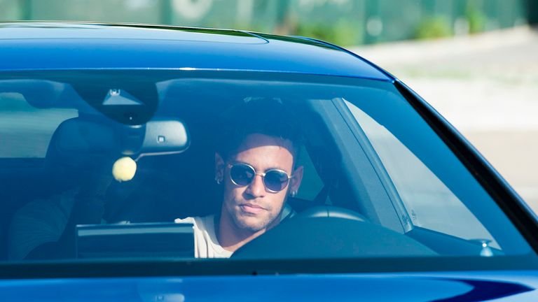 Neymar Jr. drives into Barcelona training following reports he's due to join PSG for a world record transfer fee