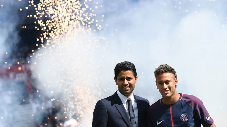 Neymar poses with PSG president Nasser Al-Khelaifi during his presentation to fans at Parc des Princes on August 5, 2017