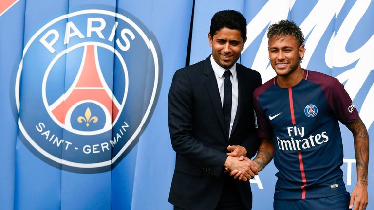 Neymar shakes hands with PSG president Nasser Al-Khelaifi following his world record £200million transfer from Barcelona