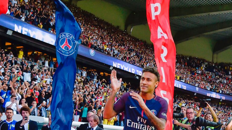 Paris Saint-Germain's Brazilian forward Neymar gestures as his arrives during his presentation to the fans at the Parc des Princes stadium in Paris on Augu