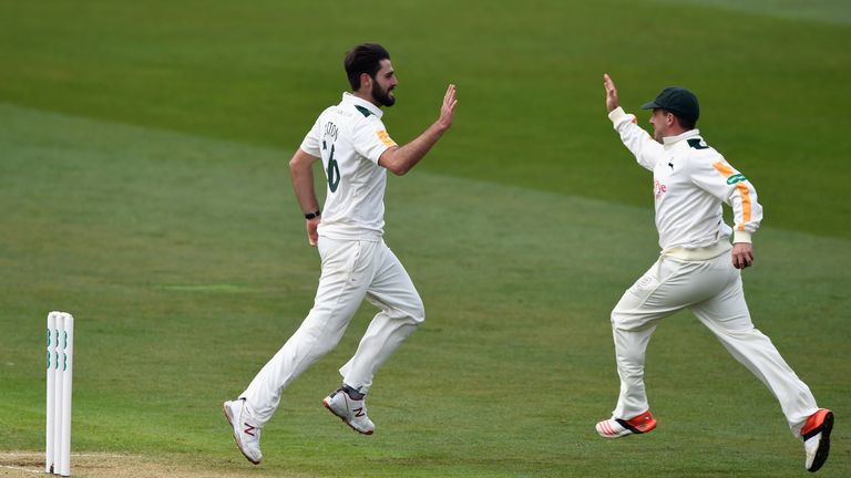 NOTTINGHAM, ENGLAND - APRIL 11:  Notts bowler Brett Hutton (l) celebrates with Steven Mullaney after taking the wicket of Surrey batsman Kumar Sangakkara d