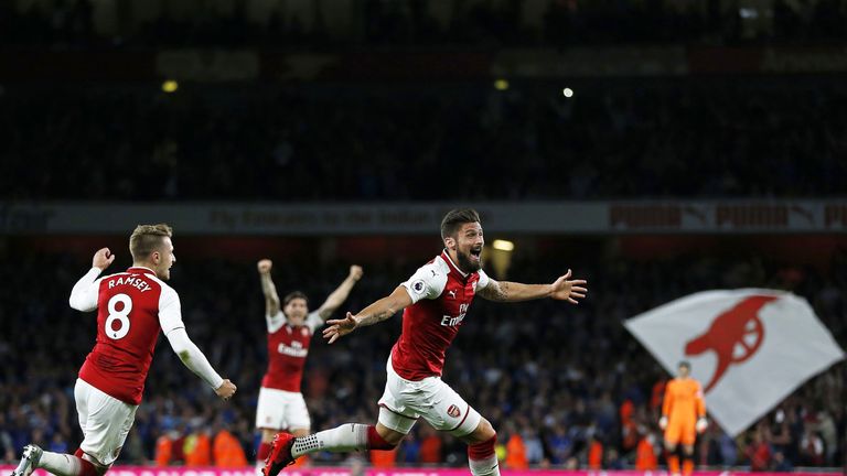 Substitute Olivier Giroud celebrates as Arsenal take a 4-3 lead at the Emirates Stadium