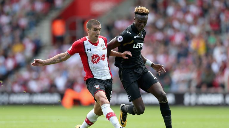 Oriol Romeu of Southampton and Tammy Abraham of Swansea City battle for possession during the Premier League