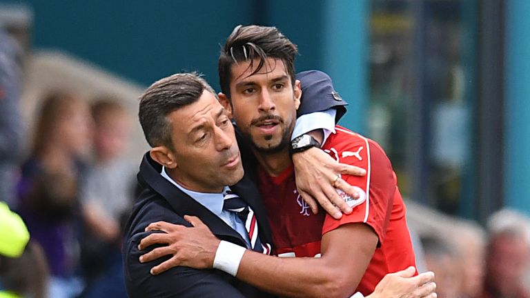 Rangers manager Pedro Caixinha (left) embraces Eduardo Herrera at full-time at Victoria Park