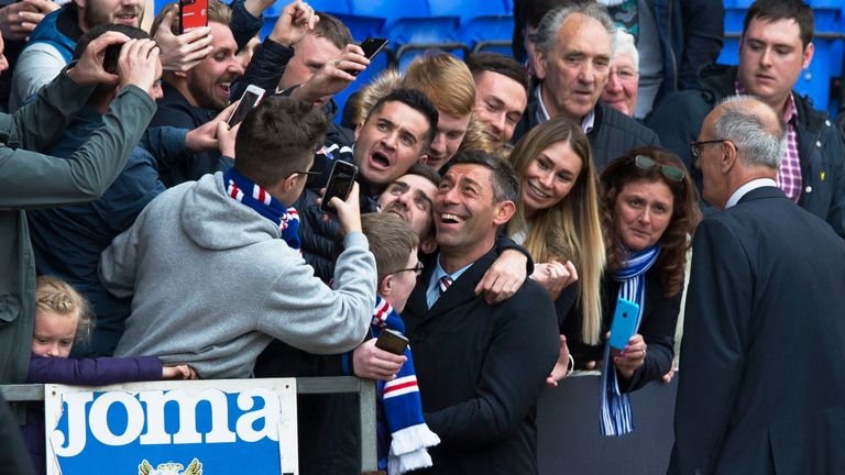 Rangers manager Pedro Caixinha (centre in coat) says he and the fans are going in the same  direction