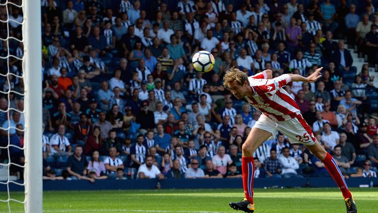Peter Crouch heads into an open net to earn Stoke a point at West Brom