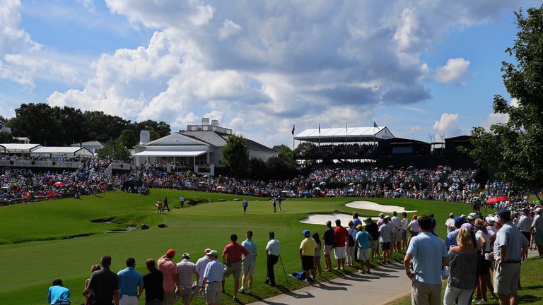 Jordan Spieth, Vijay Singh and Tommy Fleetwood on the 18th green during the third round of the PGA Championship at Quail Hollow 