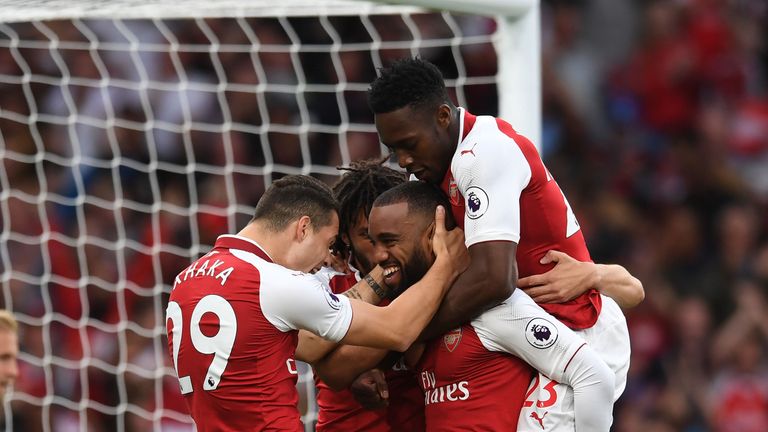 Alexandre Lacazette is congratulated by team-mates after scoring the opening goal of the game
