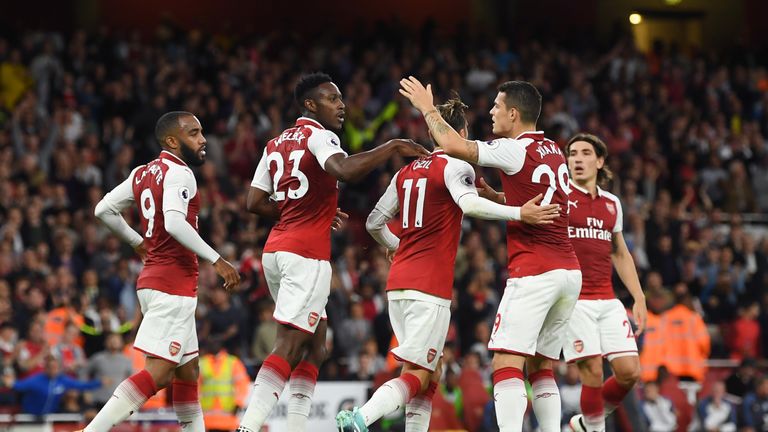 Danny Welbeck celebrates with team-mates after equalising late in the second half