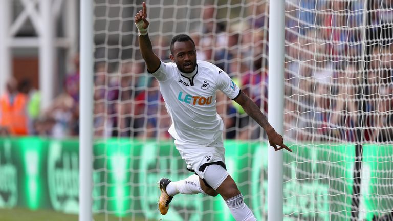 Jordan Ayew celebrates after doubling Swansea City's lead