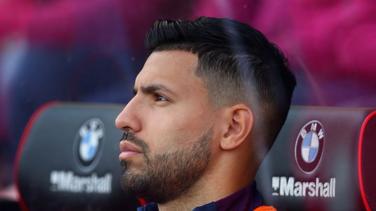 Sergio Aguero looks on from the substitutes bench