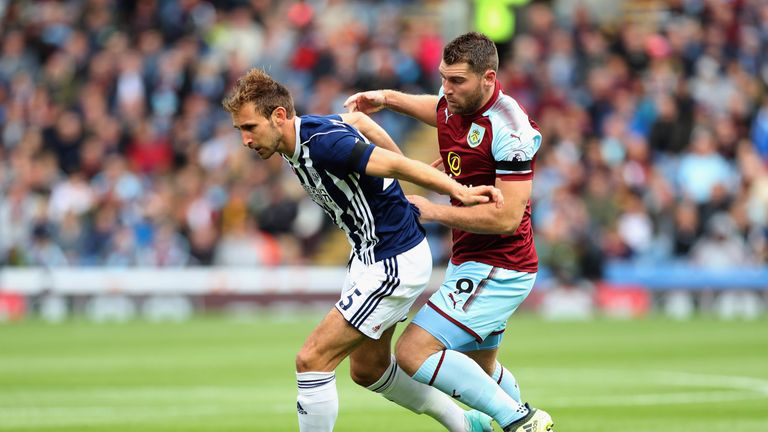 Craig Dawson and Sam Vokes in action during the first half at Turf Moor