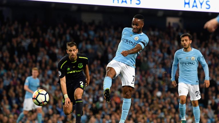 MANCHESTER, ENGLAND - AUGUST 21:  Raheem Sterling of Manchester City scores his sides first goal  during the Premier League match between Manchester City a
