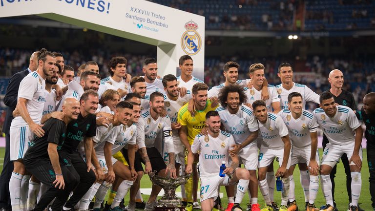 MADRID, SPAIN - AUGUST 23: Real Madrid CF players celebrate with the Santiago Bernabeu trophy after beating ACF Fiorentina 2-1 at Estadio Santiago Bernabeu