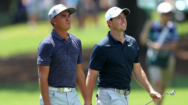CHARLOTTE, NC - AUGUST 10:  Rickie Fowler of the United States and Rory McIlroy of Northern Ireland walk along the second hole during the first round of th