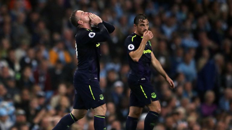 Everton's Wayne Rooney celebrates reaching 200 Premier League goals.