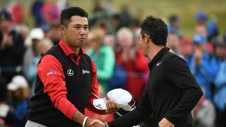 LONDONDERRY, NORTHERN IRELAND - JULY 06:  Rory McIlroy of Northern Ireland and Hideki Matsuyama of Japan shake hands on the 18th green during day one of th