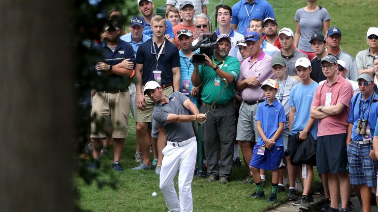 Rory McIlroy of Northern Ireland plays his shot from the rough on the 10th hole during the second round of the 2017 PGA Championship
