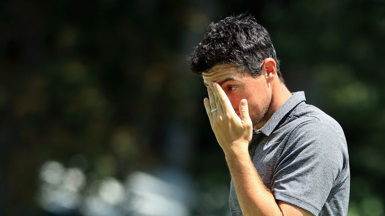 WESTBURY, NY - AUGUST 24:  Rory McIlroy of Northern Ireland reacts after putting on the 18th green during round one of The Northern Trust at Glen Oaks Club