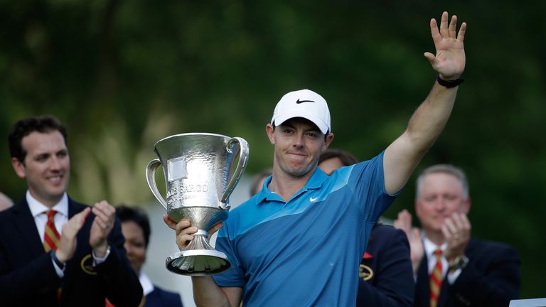 CHARLOTTE, NC - MAY 17: Rory McIlroy of Northern Ireland poses with the trophy after his win on the 18th hole during the final round at the Wells Fargo Cha