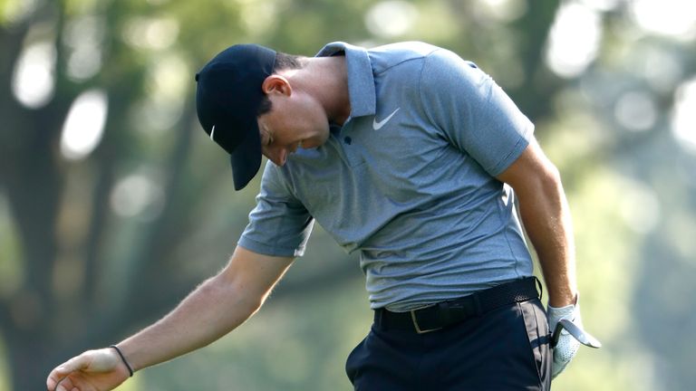 Rory McIlroy of Northern Ireland reacts to a shot on the 14th hole during the first round of the WGC-Bridgestone Invitational