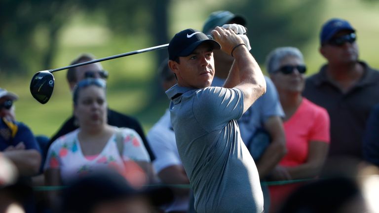 Rory McIlroy of Northern Ireland hits off the 11th tee during the first round of the World Golf Championships - Bridgestone Invitational