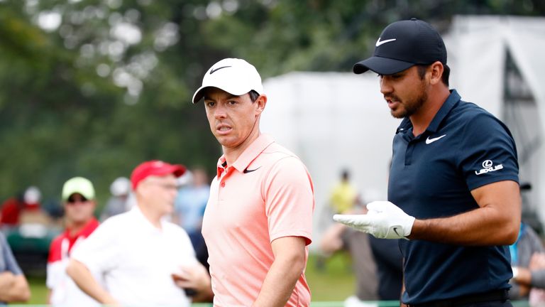 Rory McIlroy of Northern Ireland and Jason Day of Australia walk to the third tee during the second round of the World Golf Champion
