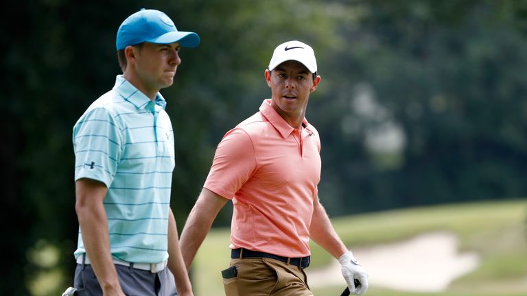 AKRON, OH - AUGUST 04:  Jordan Spieth and Rory McIlroy of Northern Ireland walk up the sixth fairway during the second round of the World Golf Championship